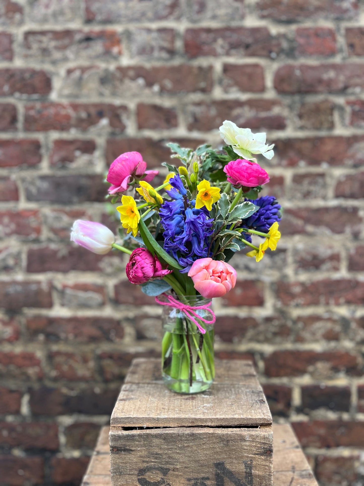 Spring Garden Jam Jar with fresh seasonal blooms in a rustic jam jar.