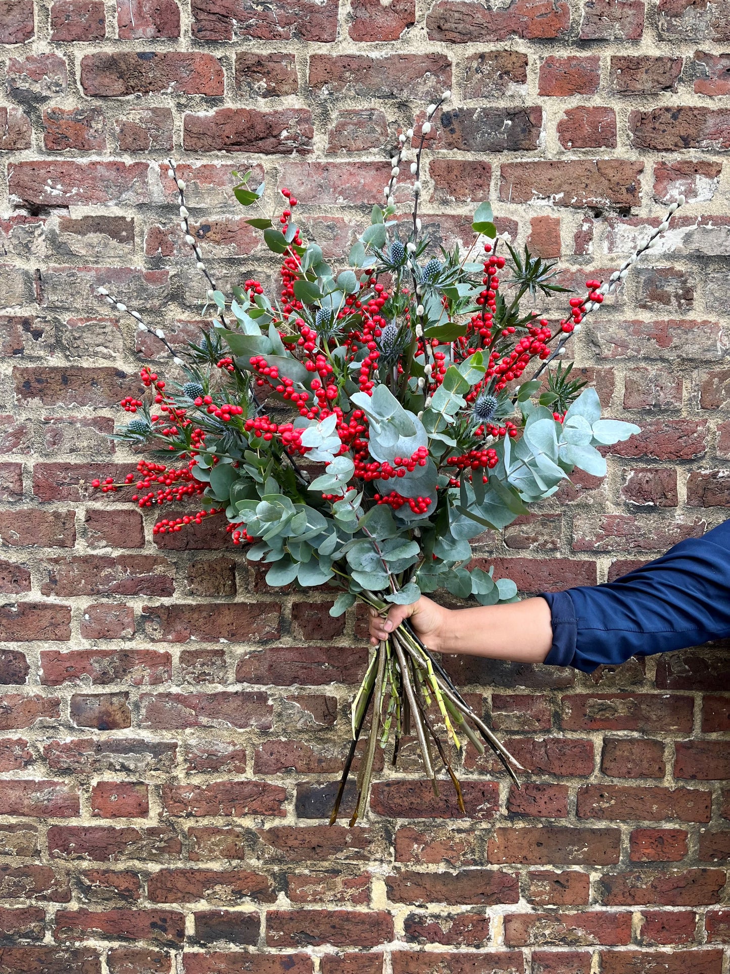Ilex berry, pussy willow, thistle and eucalyptus arrangement