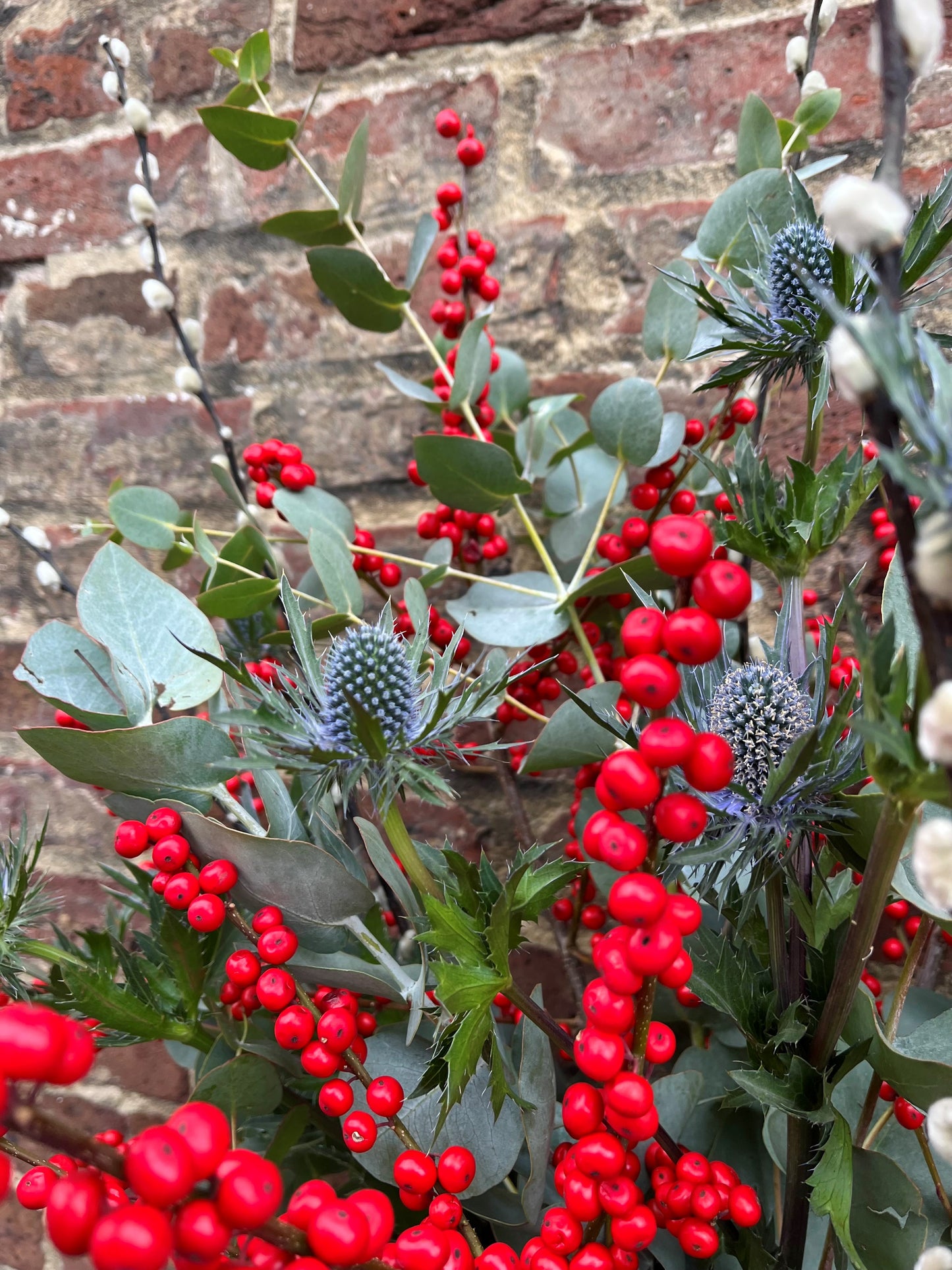 Ilex berry, pussy willow, thistle and eucalyptus arrangement