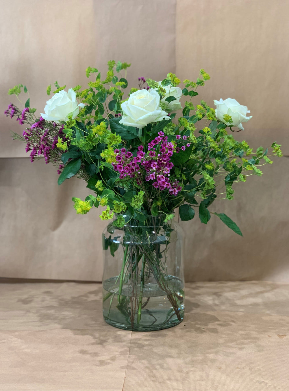 Fresh flowers arranged in a vase by Gardenia of London