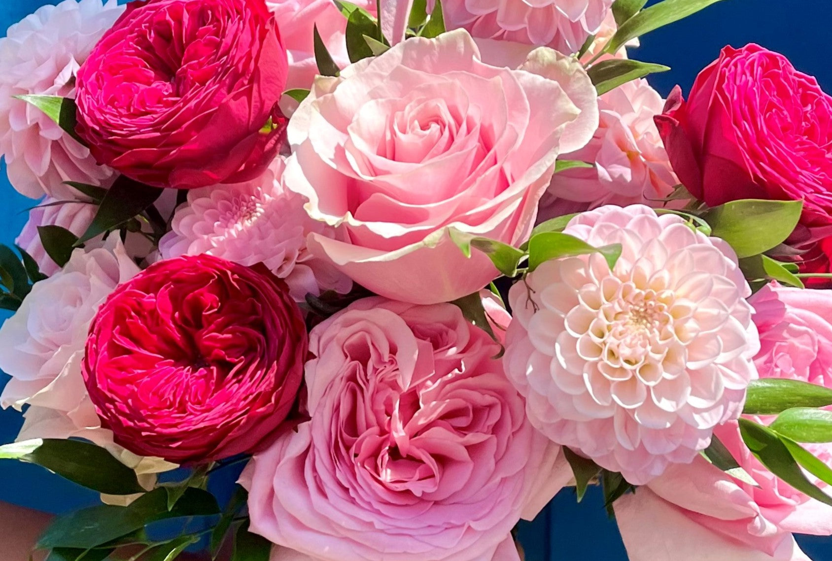 A bespoke bridal bouquet with garden Roses and Dahlias for a London wedding by Gardenia of London