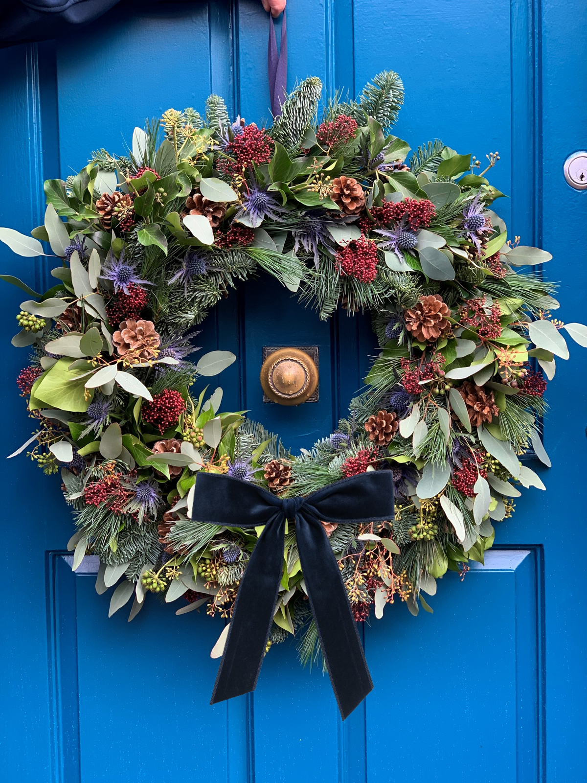Glencoe wreath with wide navy velvet bow