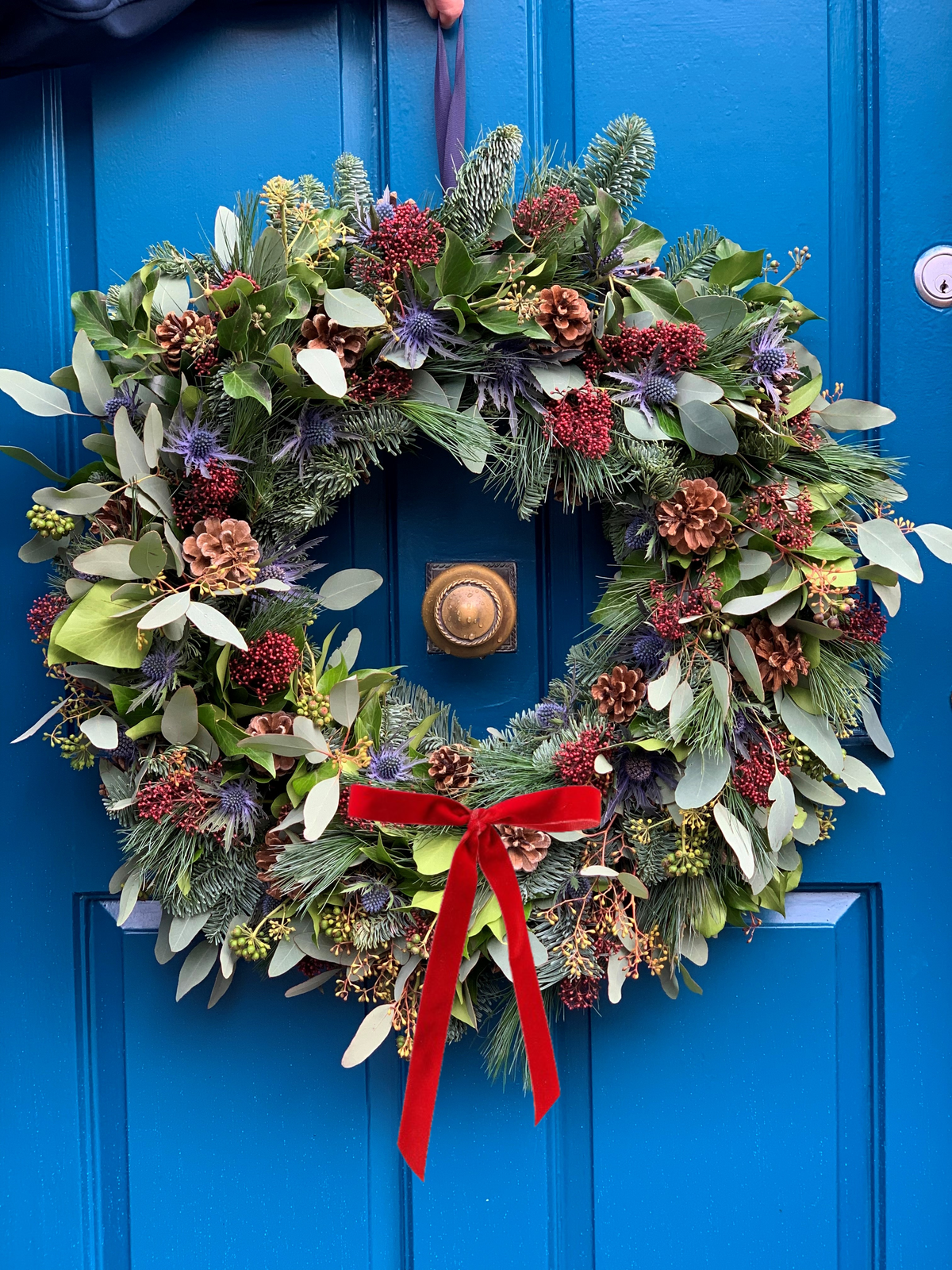 Glencoe wreath with narrow red velvet bow