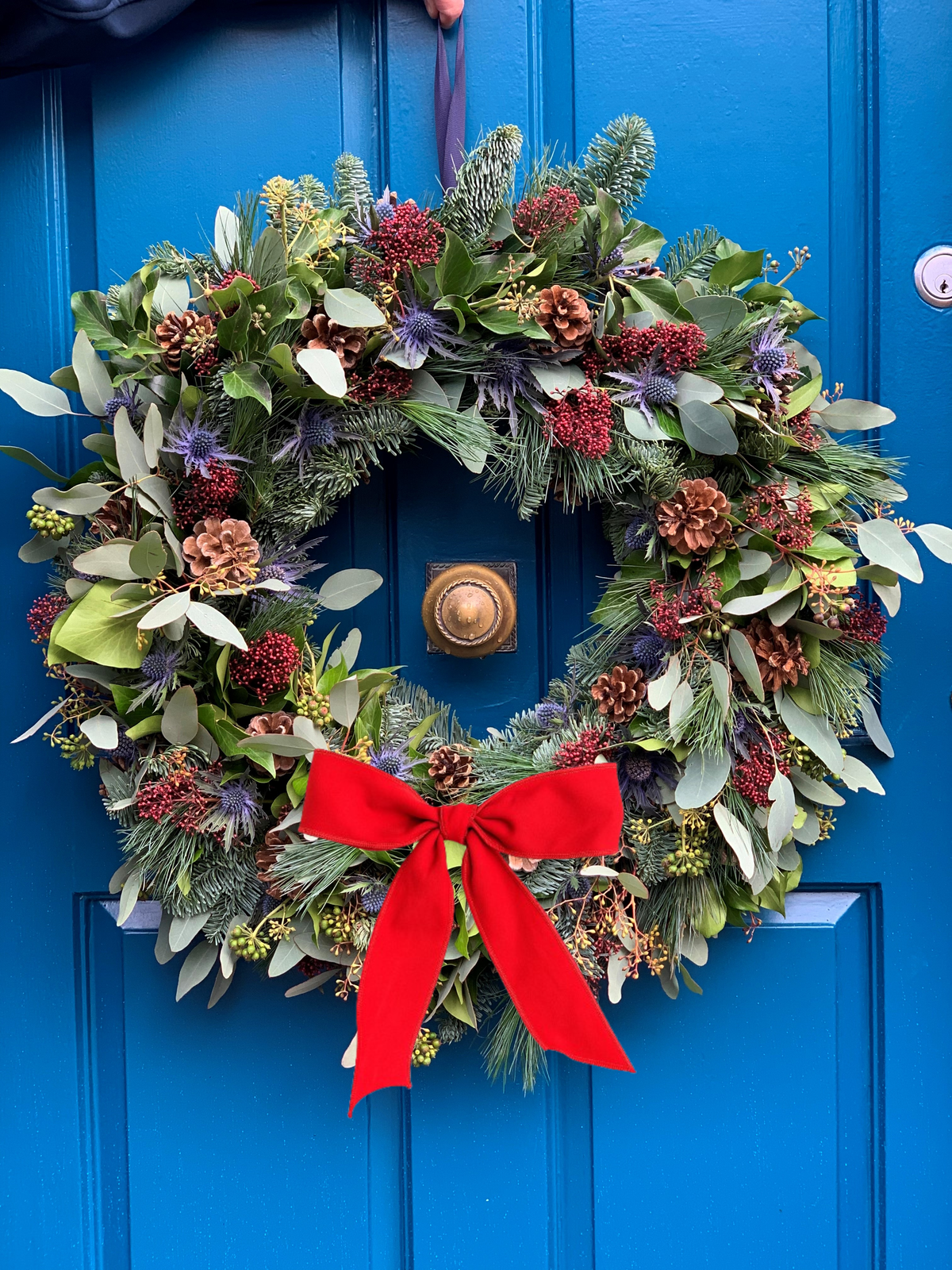 Glencoe wreath with wide red velvet bow