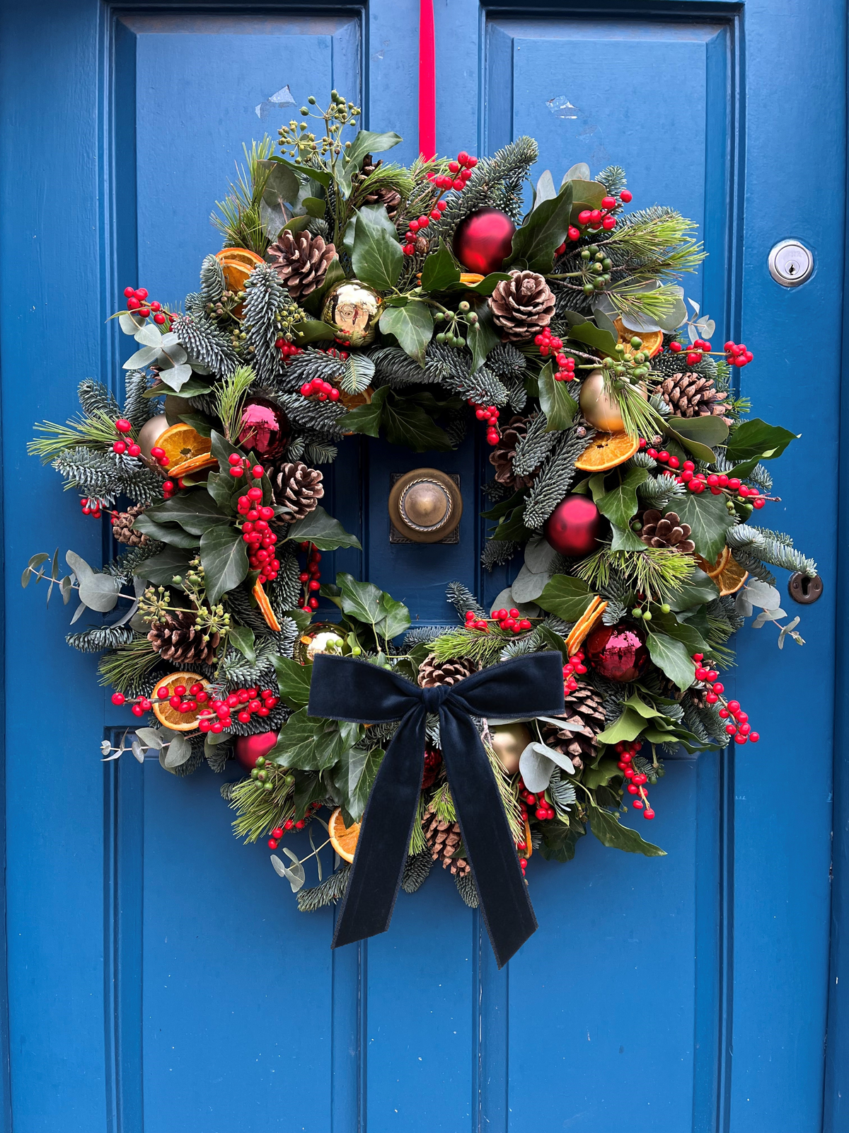 Les Portes du Soleil wreath with wide navy velvet bow