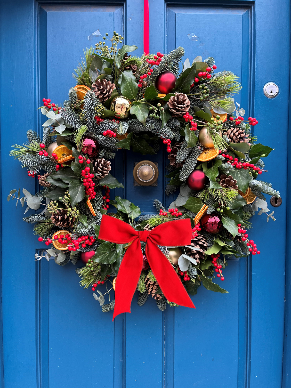 Les Portes du Soleil wreath with wide red velvet bow