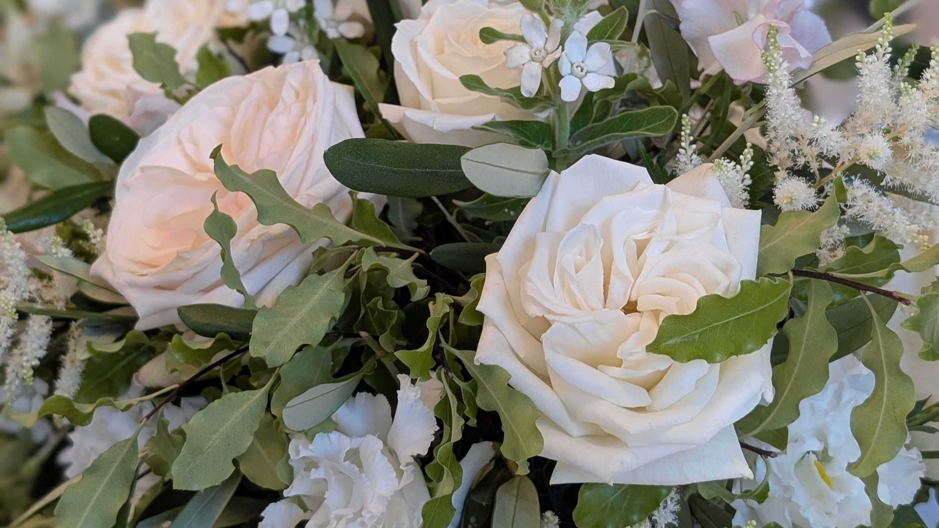 Close up of luxurious wedding flowers including garden Roses