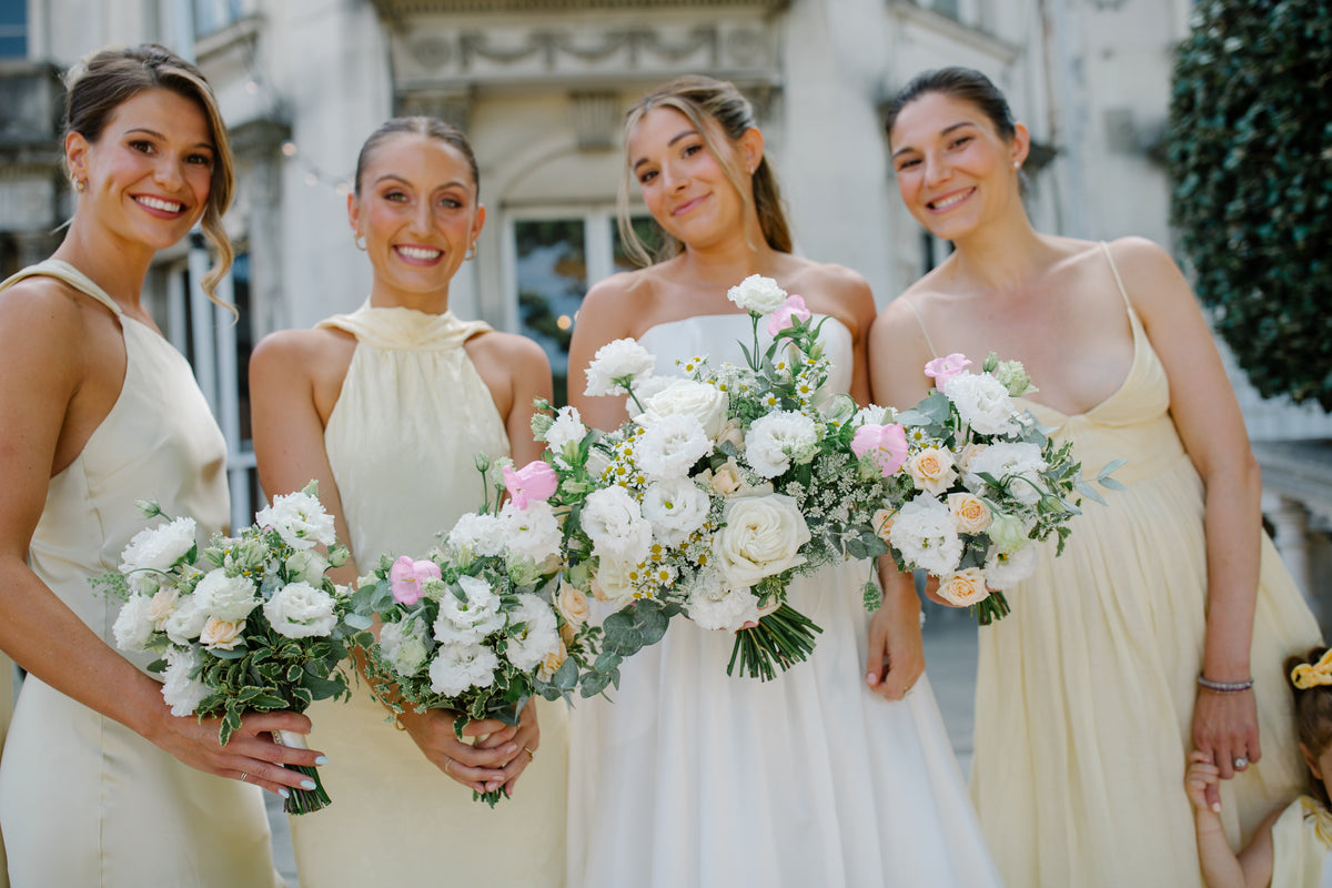 Modern wedding bridesmaids holding Gardenia bouquets at Grove House